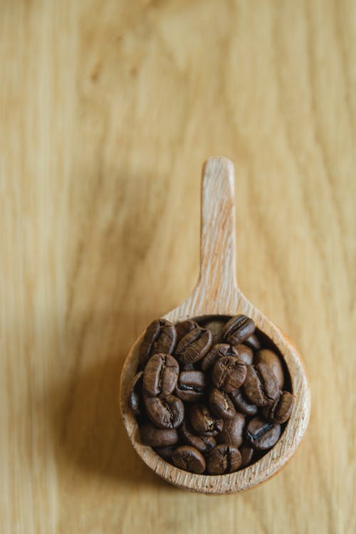 Free Bowl of coffee beans on table Stock Photo