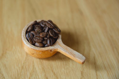 Free Small deep spoon with coffee beans Stock Photo