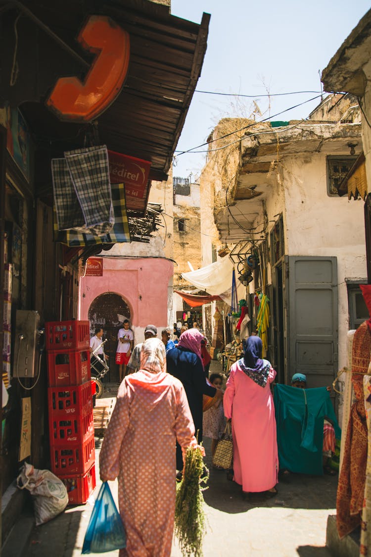 Faceless Muslim Women Walking In Oriental Street Market