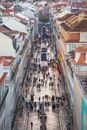 People walking on narrow street