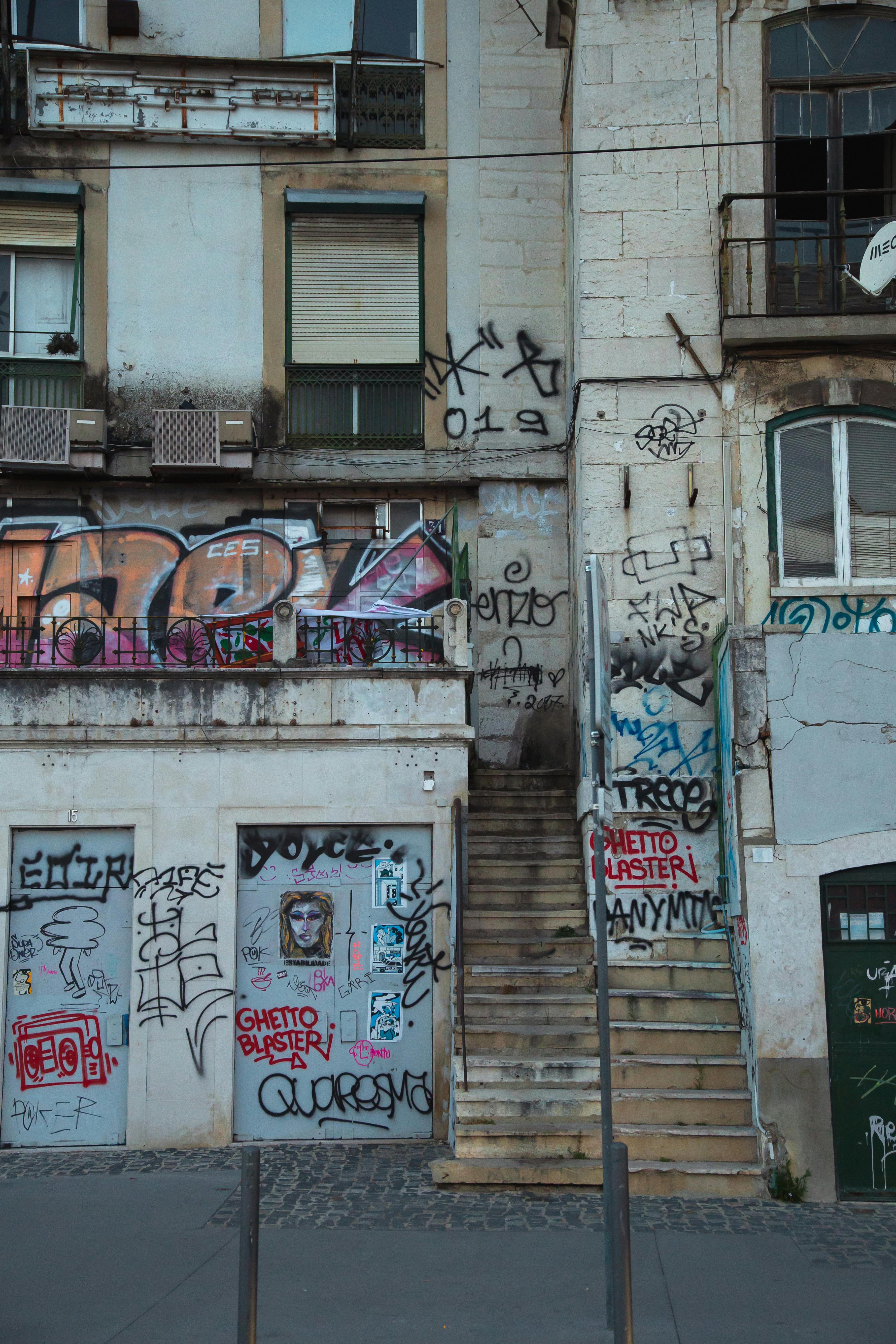 exterior of shabby building with graffiti