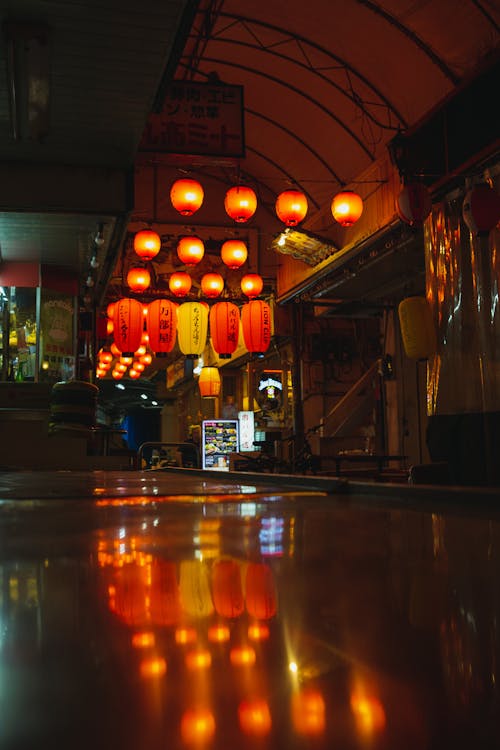 Illuminated street lamps in night street