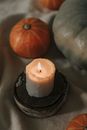 White Pillar Candle on Black Round Plate