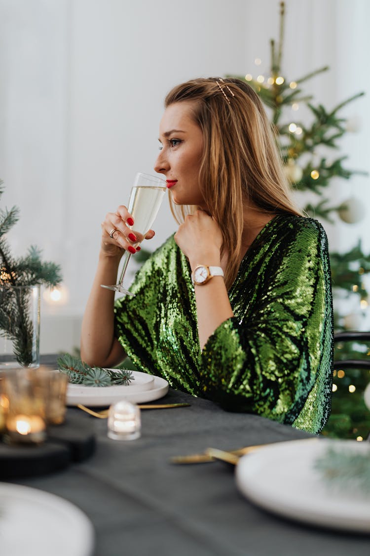 Woman Sitting At Christmas Table