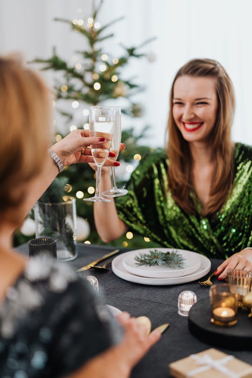 Women Drinking Wine at Dinner on Christmas 