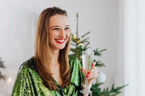 Free Smiling Woman Holding a Glass of Wine Stock Photo