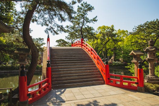 Beautiful Taiko Bashi bridge in Sumiyoshi Grand Shrine, Osaka, Japan, surrounded by lush greenery and peaceful atmosphere.