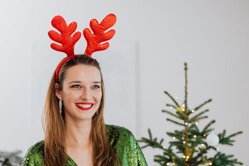 Free Pretty Woman Wearing a Reindeer Headband Stock Photo