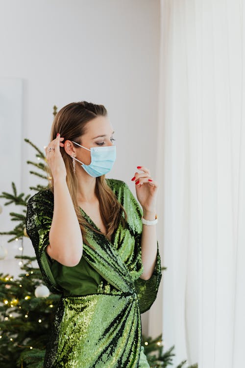 Woman in Green Dress Wearing a Face Mask