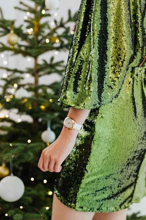 Shallow Focus Photo of Person Wearing a Green Sequin Dress