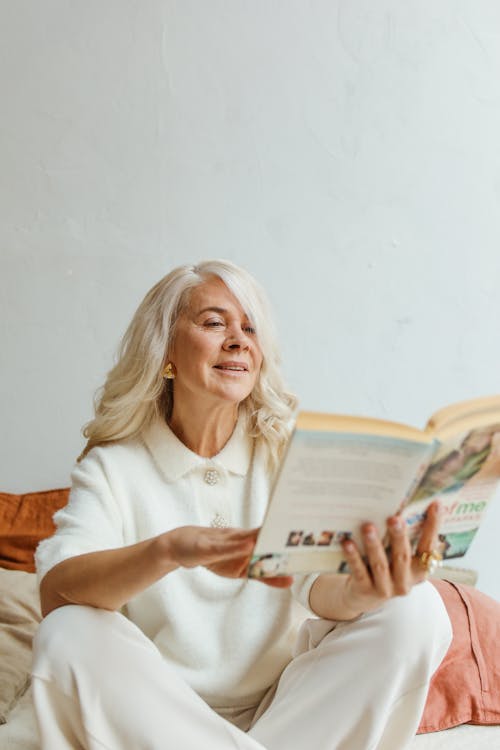 Free Elderly Woman Reading a Book Stock Photo