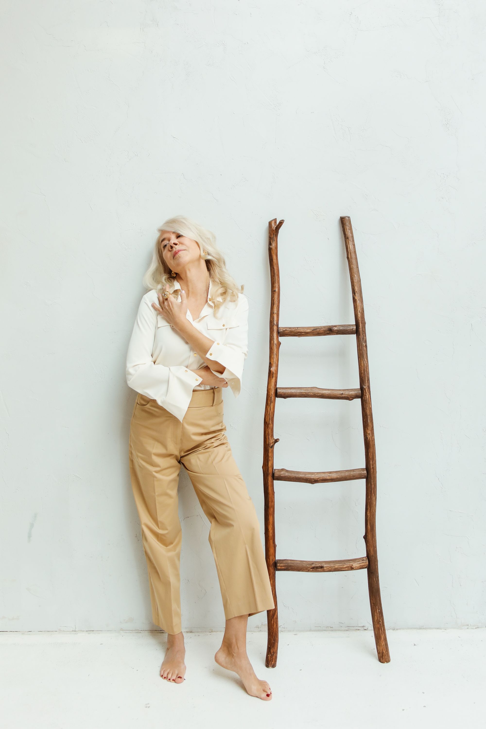 A Woman in White Long Sleeve Shirt and Brown Pants · Free Stock Photo