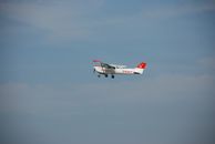 White and Red Airplane in Mid Air