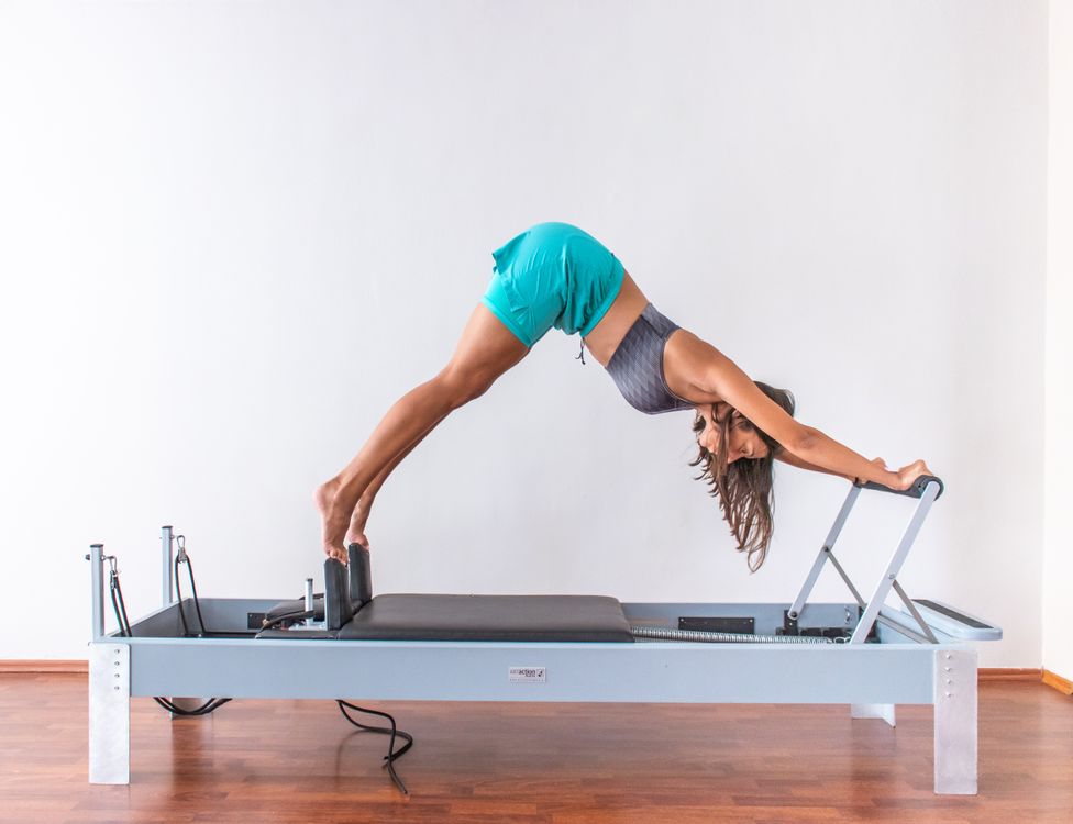 Close-up of a Pilates resistance ring in use, held between hands