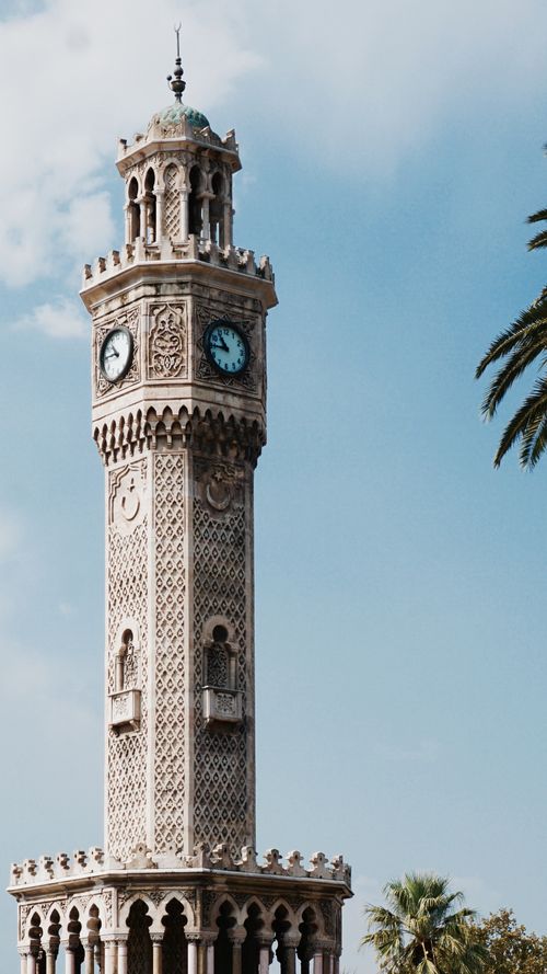 Free The iconic Izmir Clock Tower, a historic landmark, stands proudly under a clear blue sky in Turkey. Stock Photo