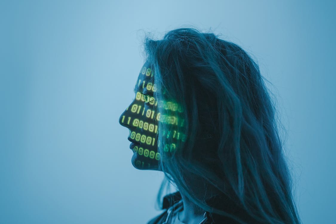 Free A Woman with Number Code on Her Face while Looking Afar Stock Photo