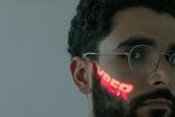 Man in White Framed Eyeglasses while Looking at the Camera