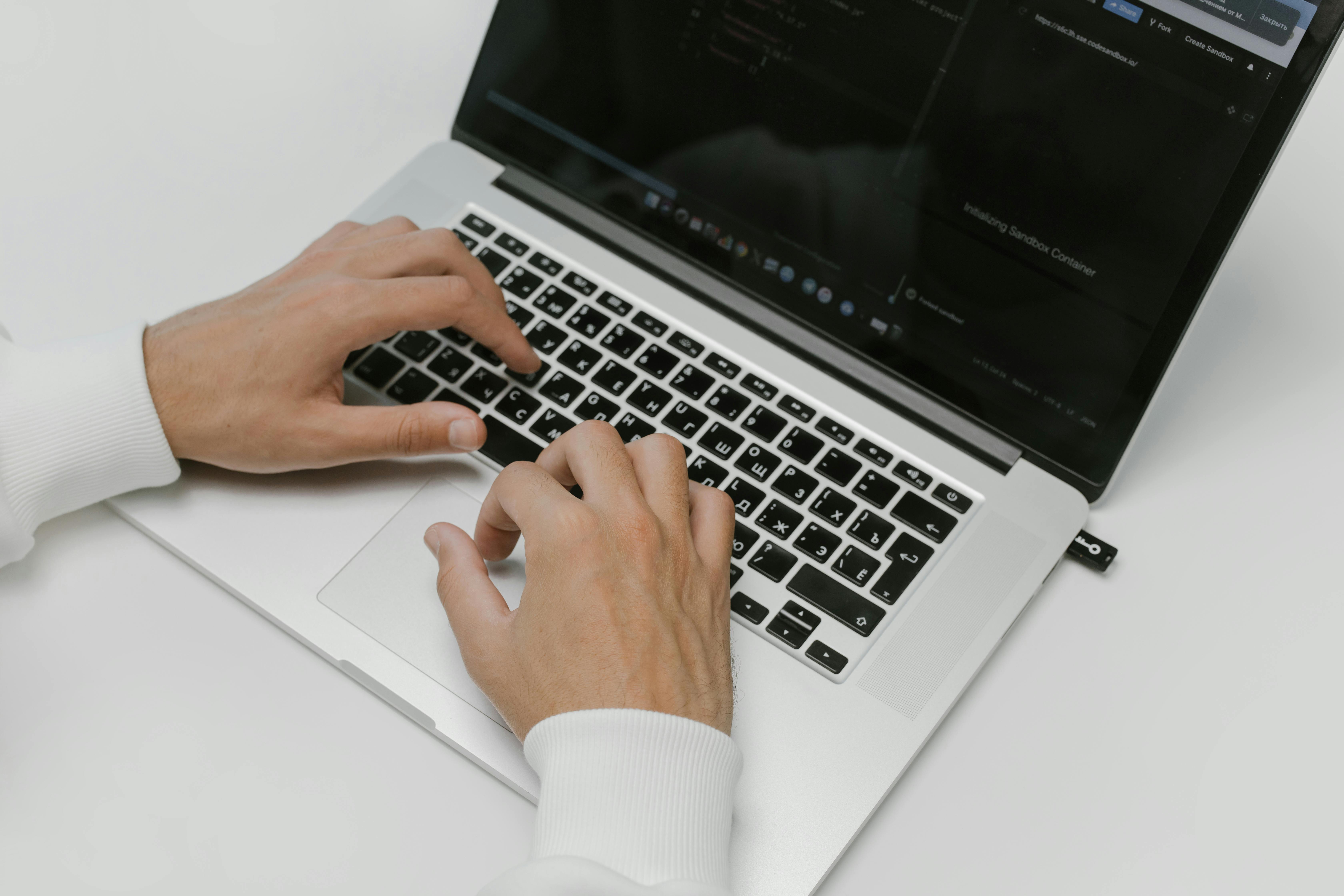 hands on a laptop keyboard