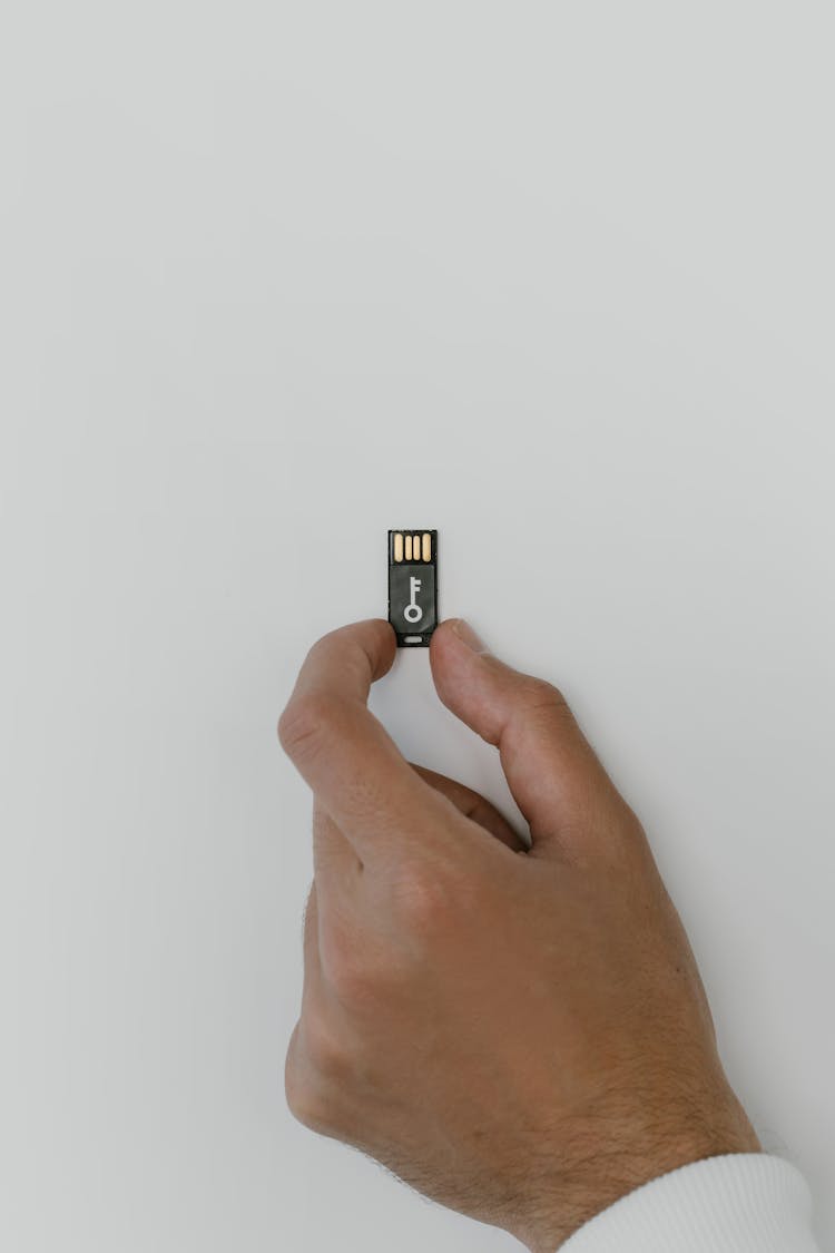 Hand Holding A USB Flash Drive