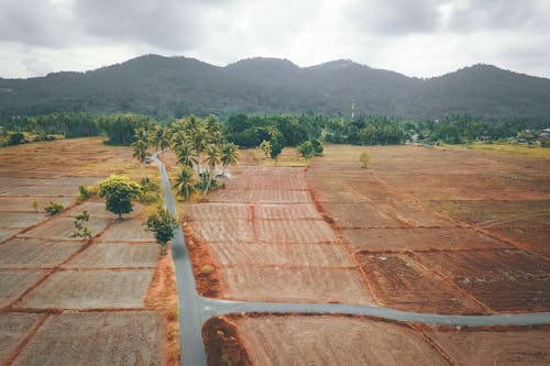 Agricultural farm fields surrounded by hills