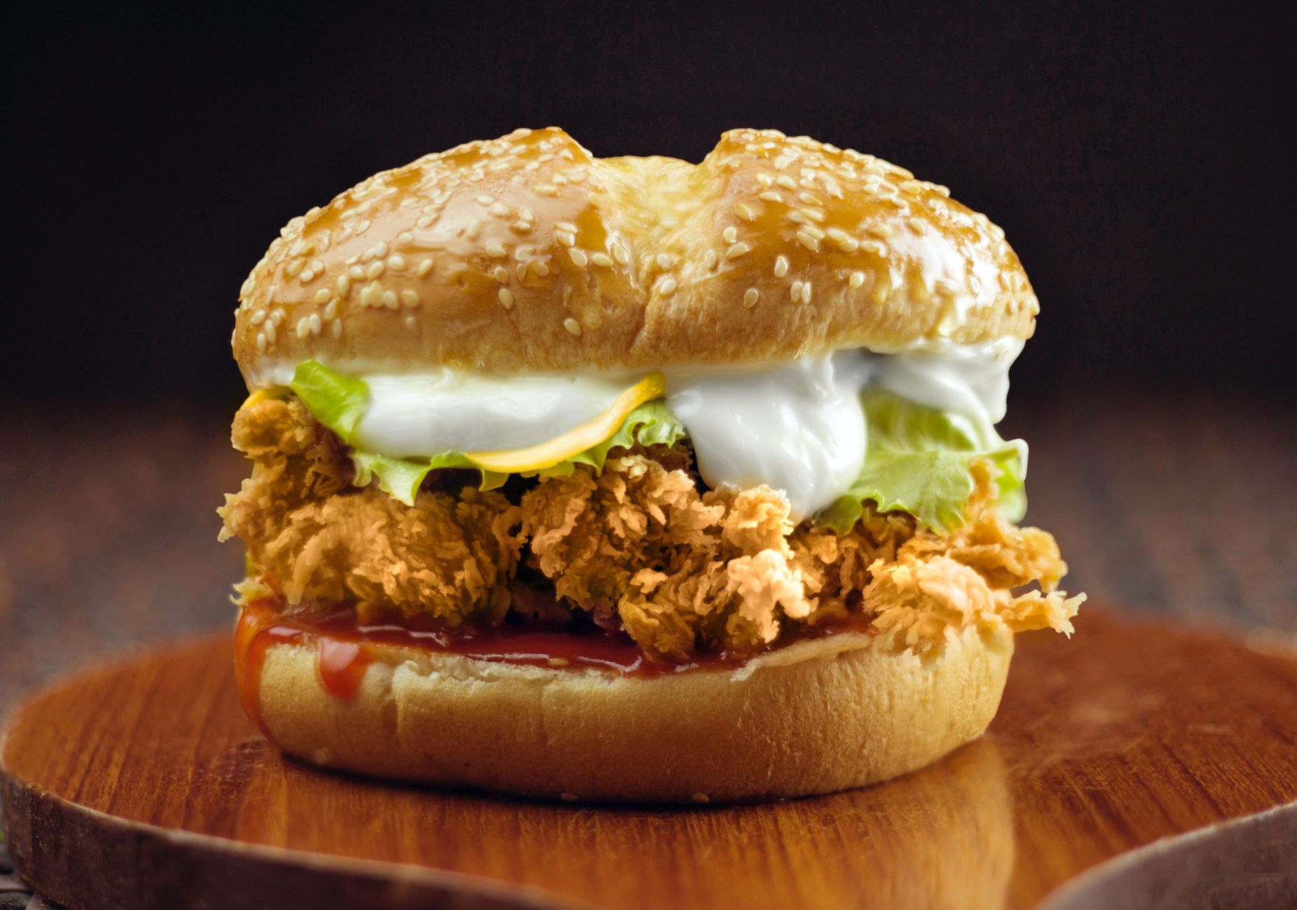 Variety of chicken sandwiches lined up with different toppings