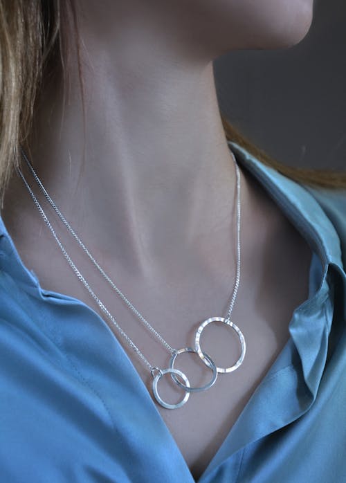 Free Close-up of Silver Necklace on Woman Neck Stock Photo