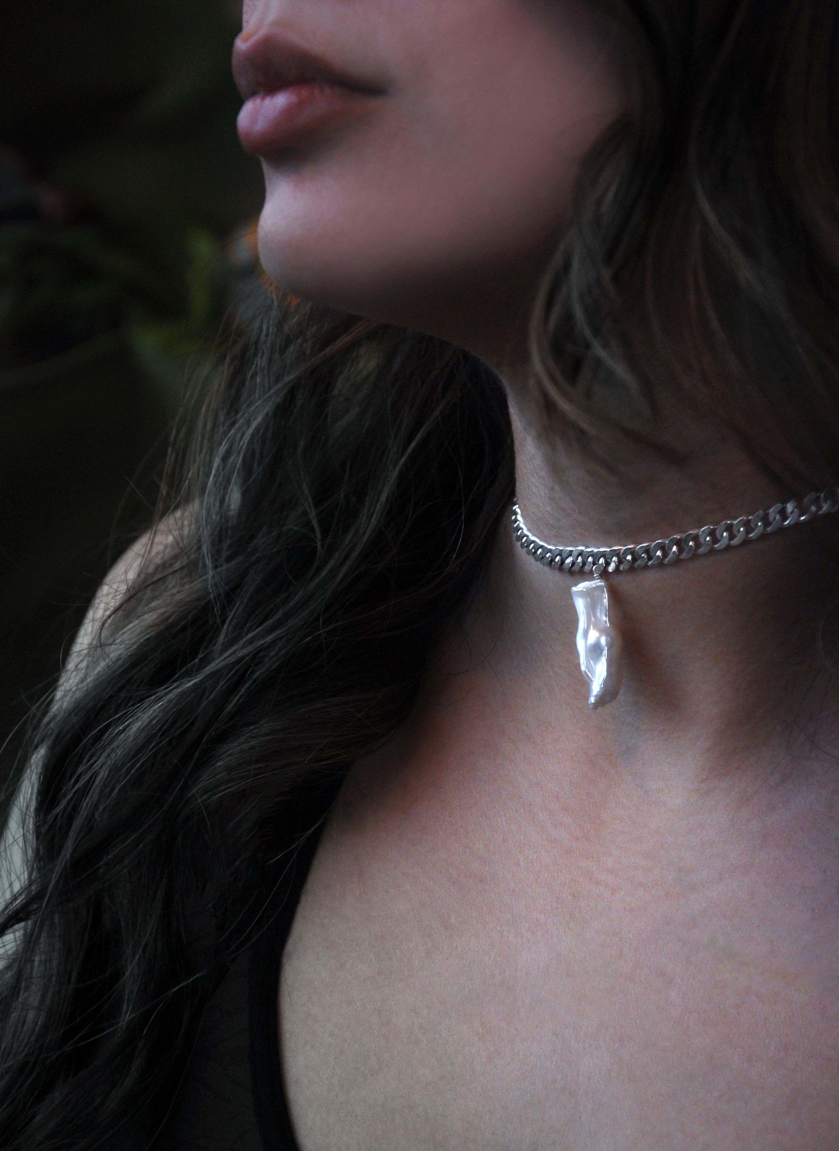 Vylore silver necklace featuring a contemporary pendant design