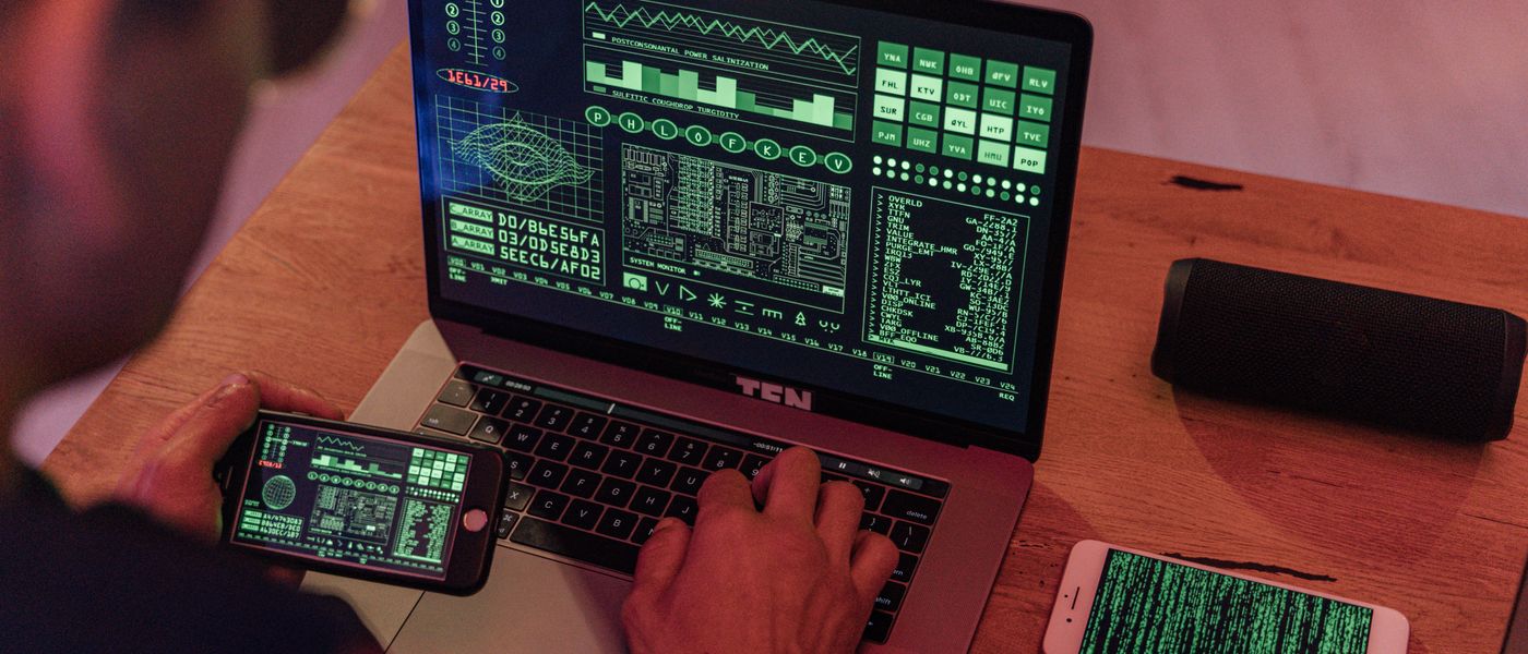 IT professional analyzing a cybersecurity threat dashboard, emphasizing ransomware protection SMB