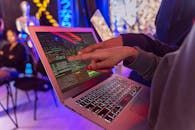 Person Using Macbook Air on Table