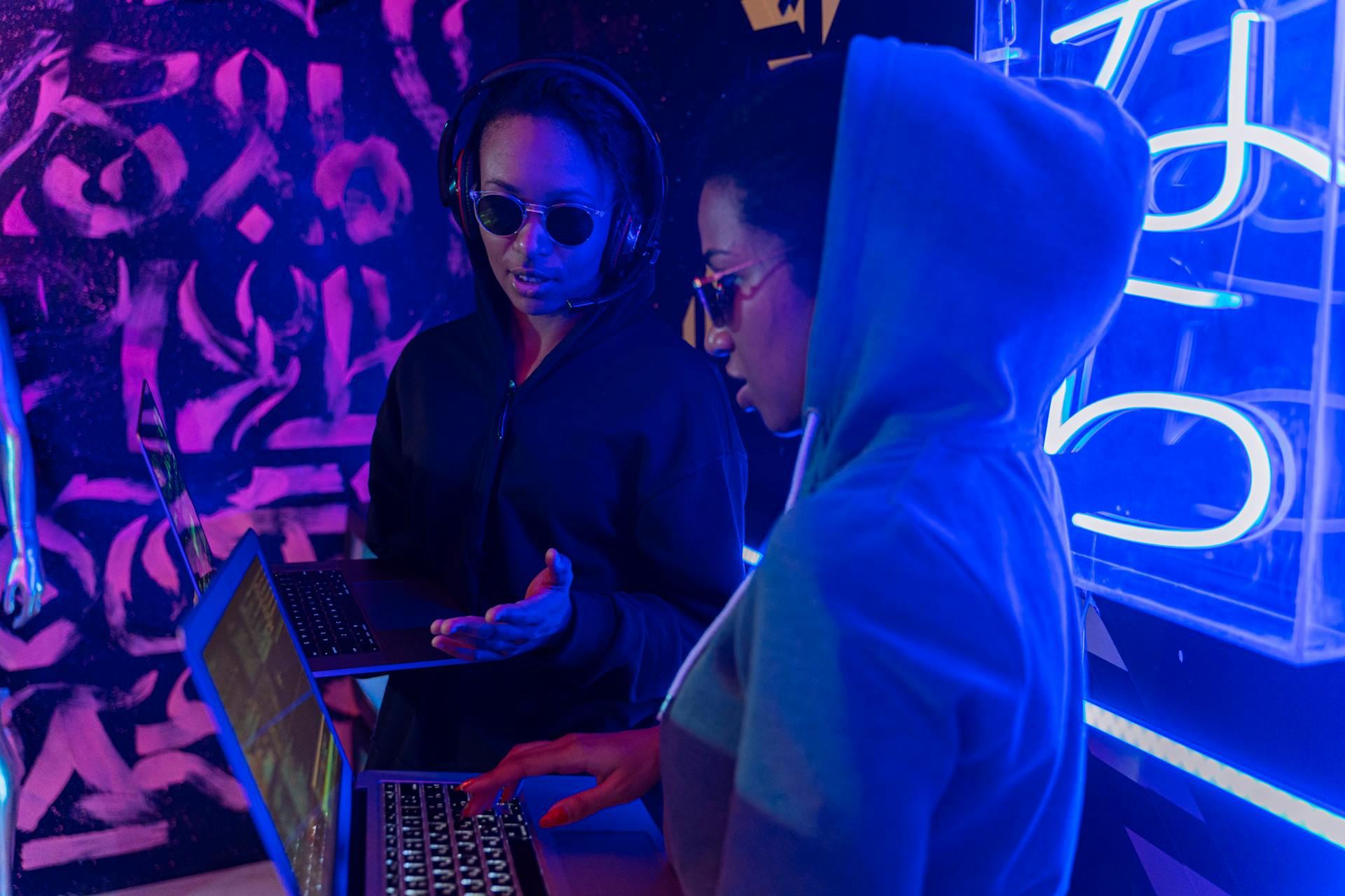 Man in Black Hoodie Using Black Laptop Computer