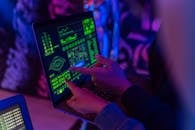 Person Holding Black Tablet Computer