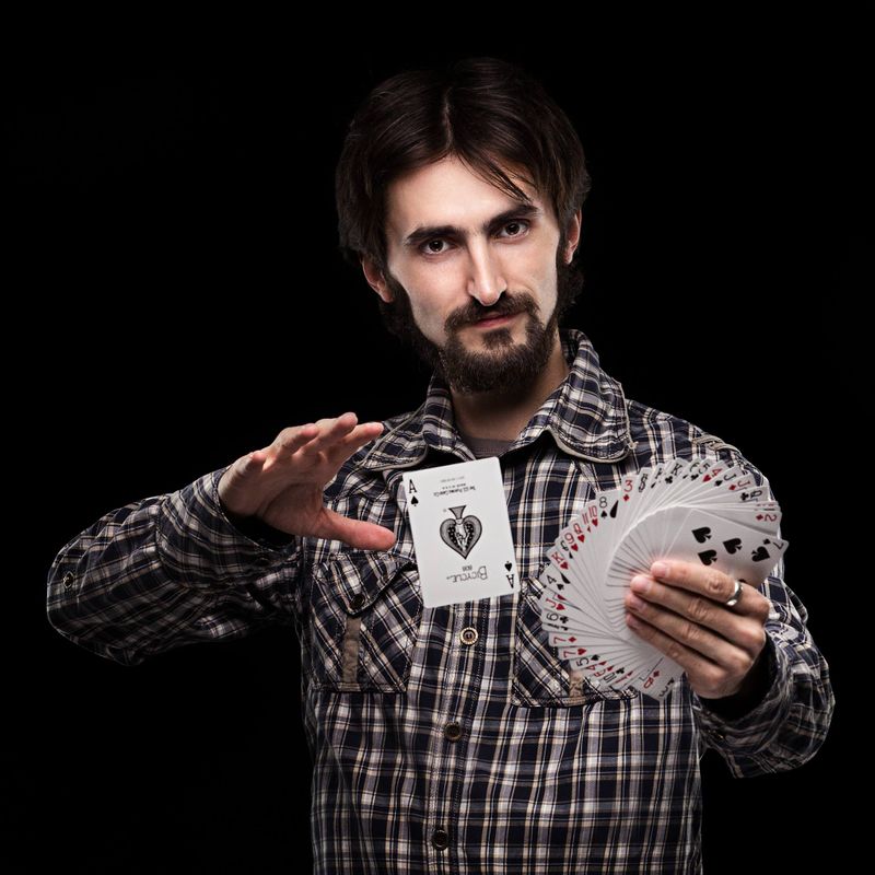 Close-up magician performing coin tricks for children in Faridabad