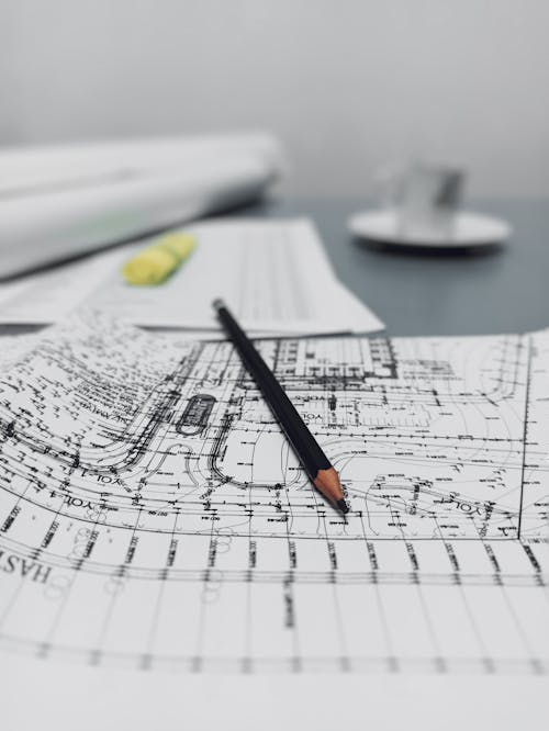 Free Close-up of Pencil on Blueprint Document Stock Photo