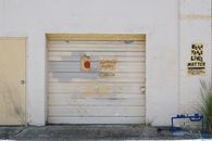 Brown Wooden Wall With White and Brown Wooden Door