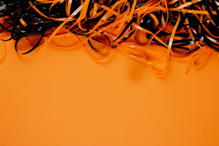 Tangled Ribbons On Orange Background