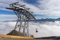 Gondola Lift in Mountains Covered with Clouds