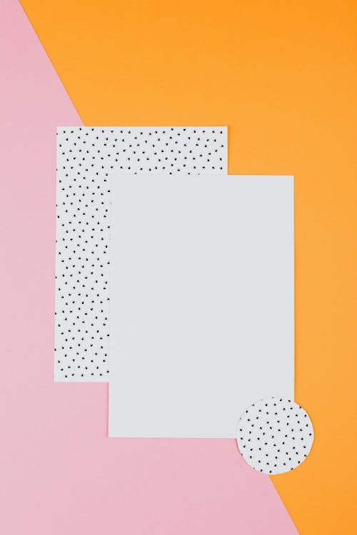 Free White Paper on Orange and Pink Polka Dot Textile Stock Photo