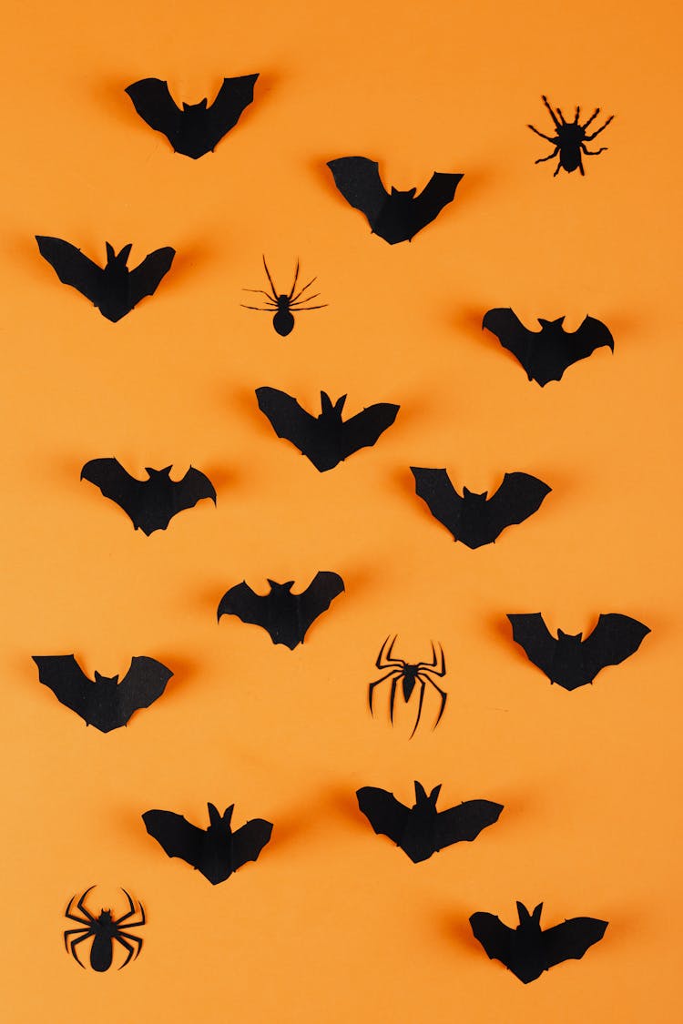 Paper Bats And Spiders On Orange Background