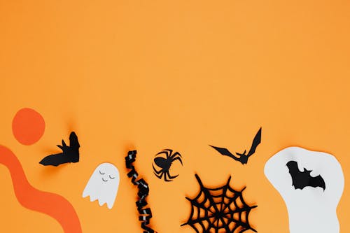 Paper Halloween Decorations on an Orange Background