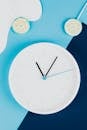 White and Blue Analog Wall Clock