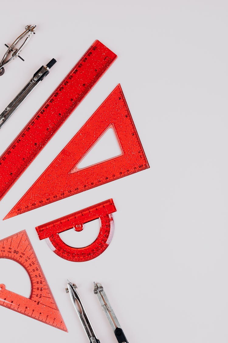 Red Rulers And Calipers On White Background