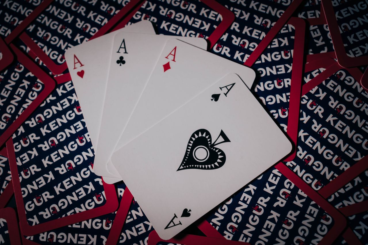 four aces from a card deck arranged on a unique playing card pattern b