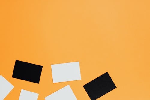 Black and White Cardboards over a Orange Surface