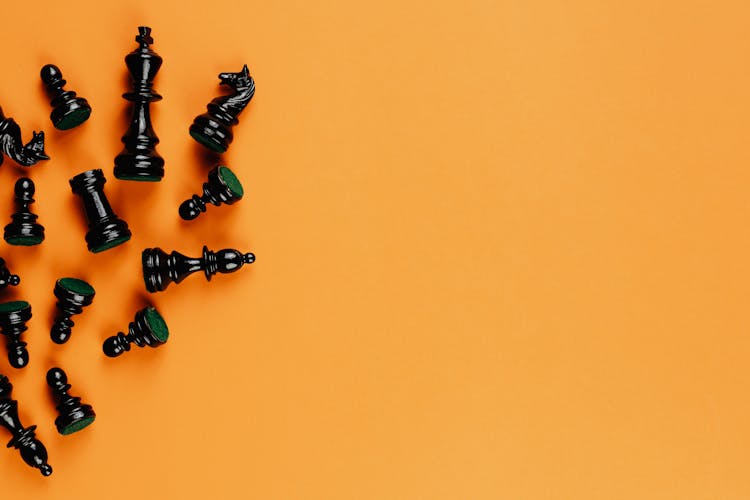 Black Chess Pieces On Yellow Background