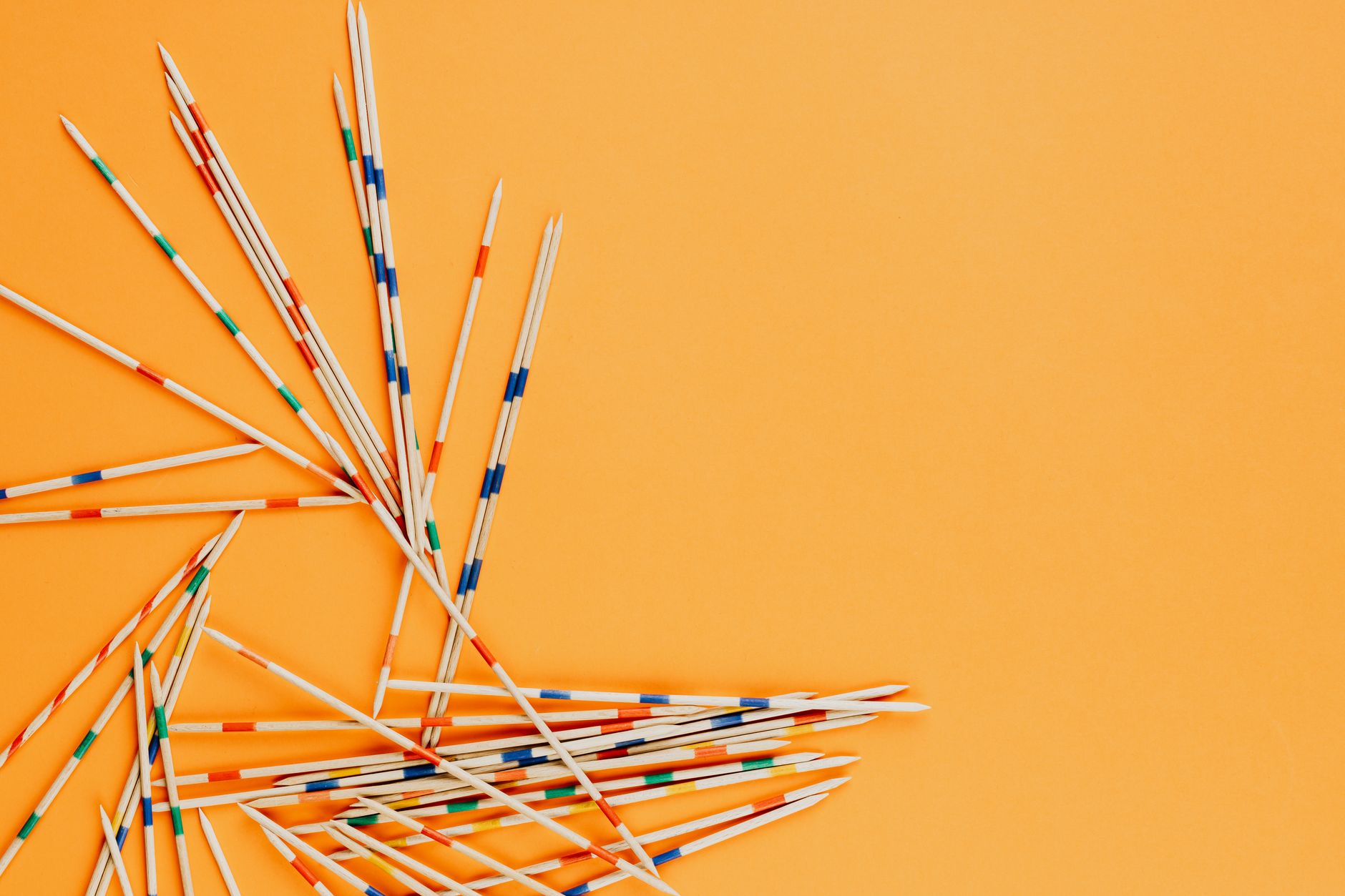 Blue and White Sticks on Yellow Metal Rack