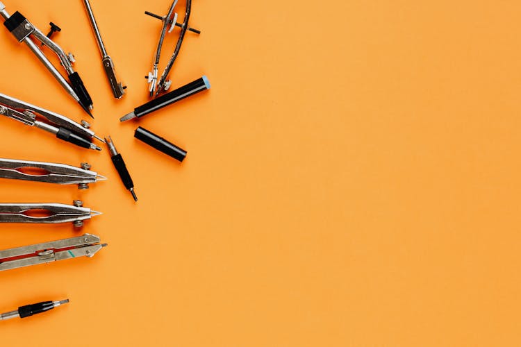 Metal Calipers On Yellow Background