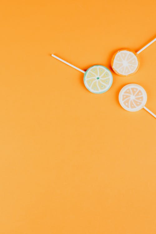 Round Lollipops on Yellow Background