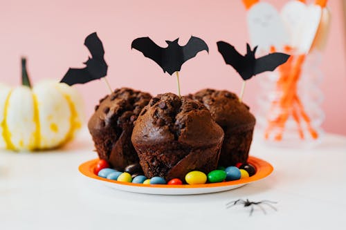 Free Chocolate Cupcakes With Halloween Bat Decorations Stock Photo