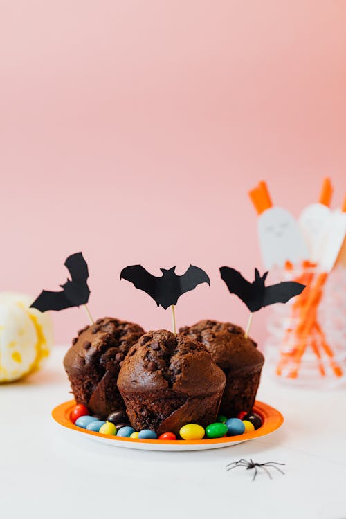 Free Chocolate Cupcakes With Halloween Bat Decorations Stock Photo
