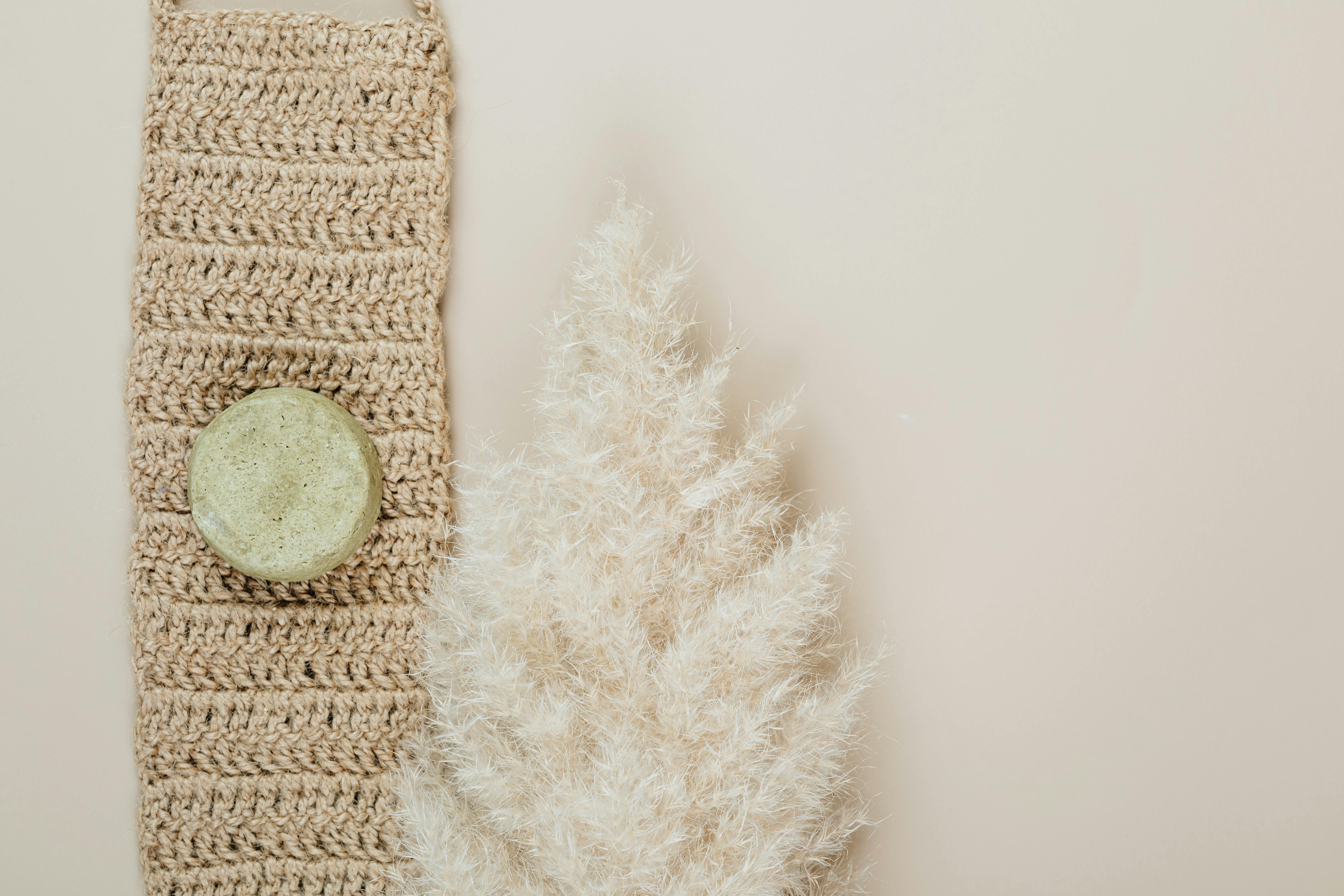 Eco-friendly handmade soap set on cozy crochet with pampas grass.